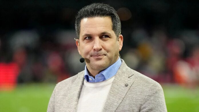 Adam Schefter Looks On Espn Desk 696x392